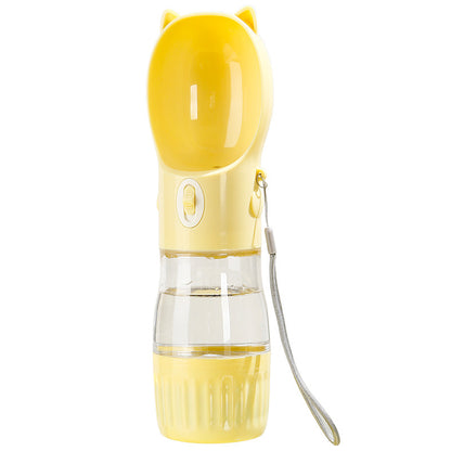 Yellow pet water bottle with a clear section on a neighborhood background
